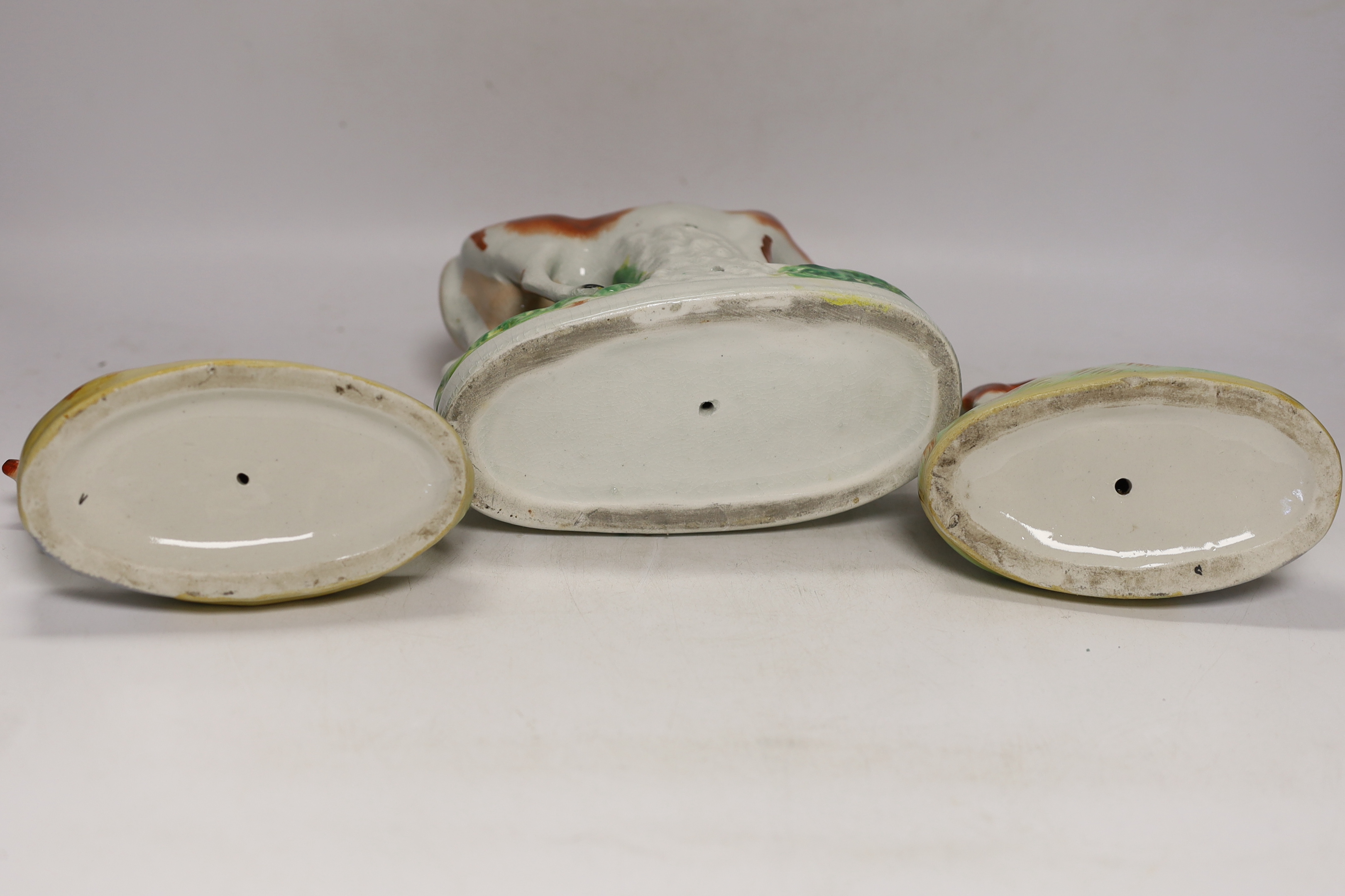 Three Victorian Staffordshire cow groups, tallest 15cm high
